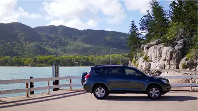 car parked besie ocean