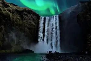 northern lights over waterfall