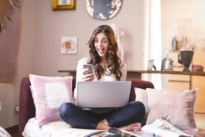 woman sitting with her laptop open