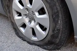 rental car tyre with puncture that can be covered by car hire excess insurance