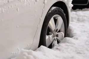 car in snow with wheels and tyres protected by car hire excess insurance