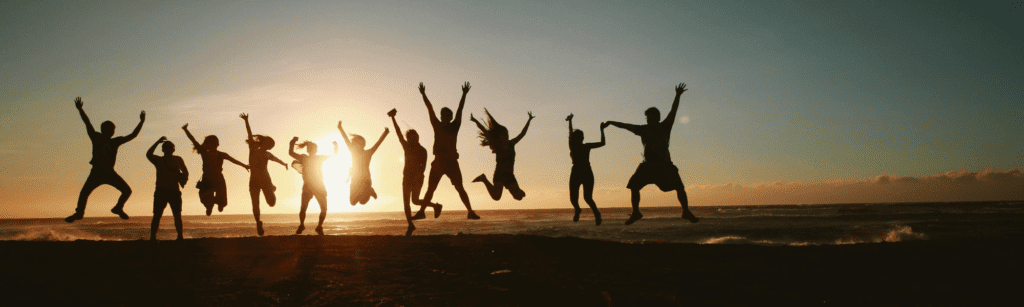 people jumping for joy because they have bought cheap car hire excess insurance