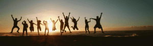 people jumping for joy because they have bought cheap car hire excess insurance