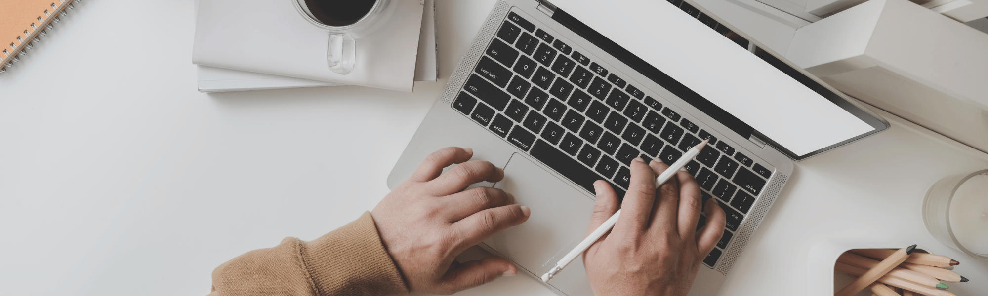 person using a laptop at a desk