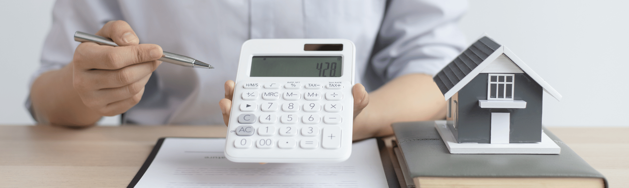 calculator and miniature house