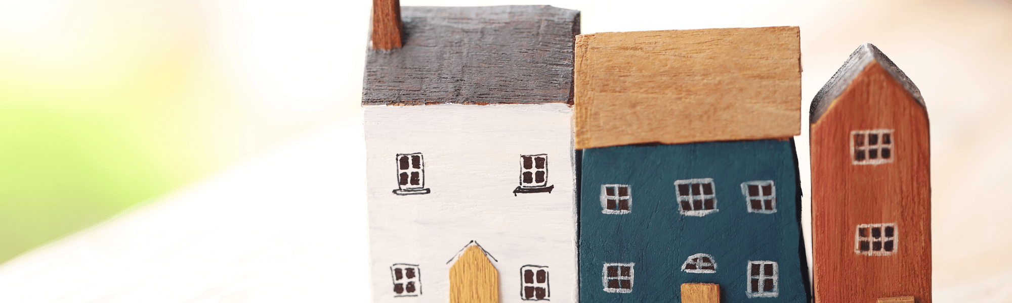 three mini wooden houses