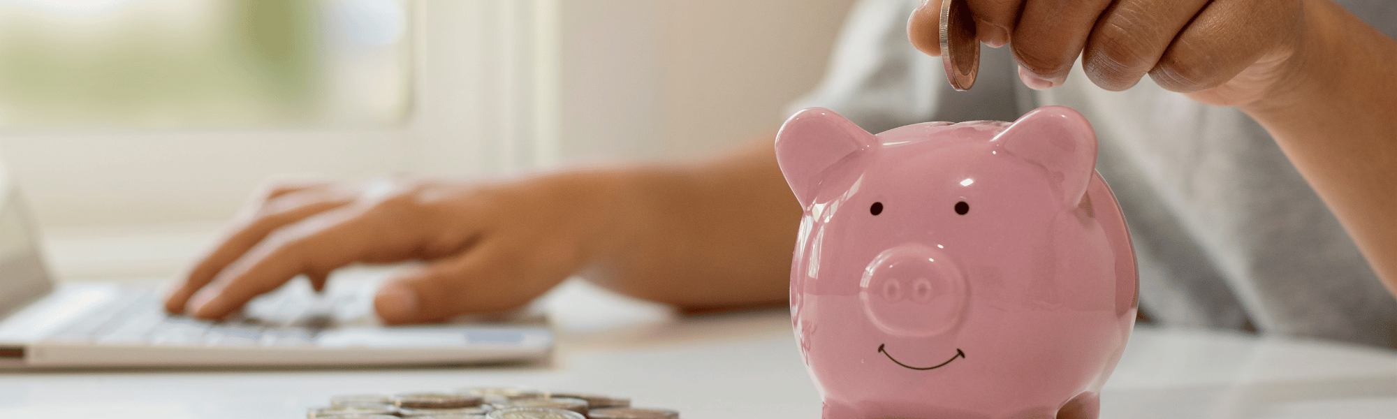 person with piggy bank saving money