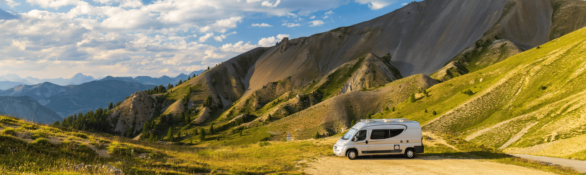 motorhome covered by excess insurance parked with a view of mountains